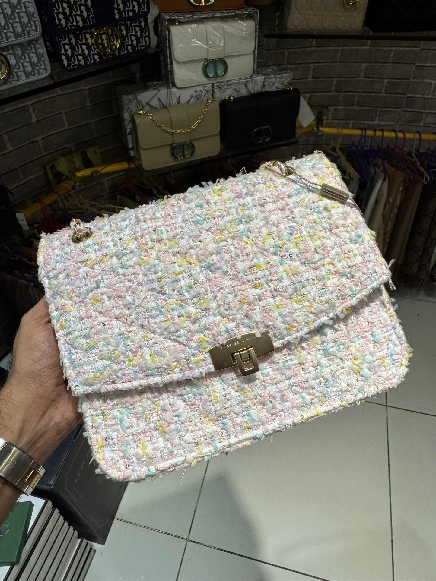 The black sequined/tweed chain-strap bag (which is a Charles & Keith bag).