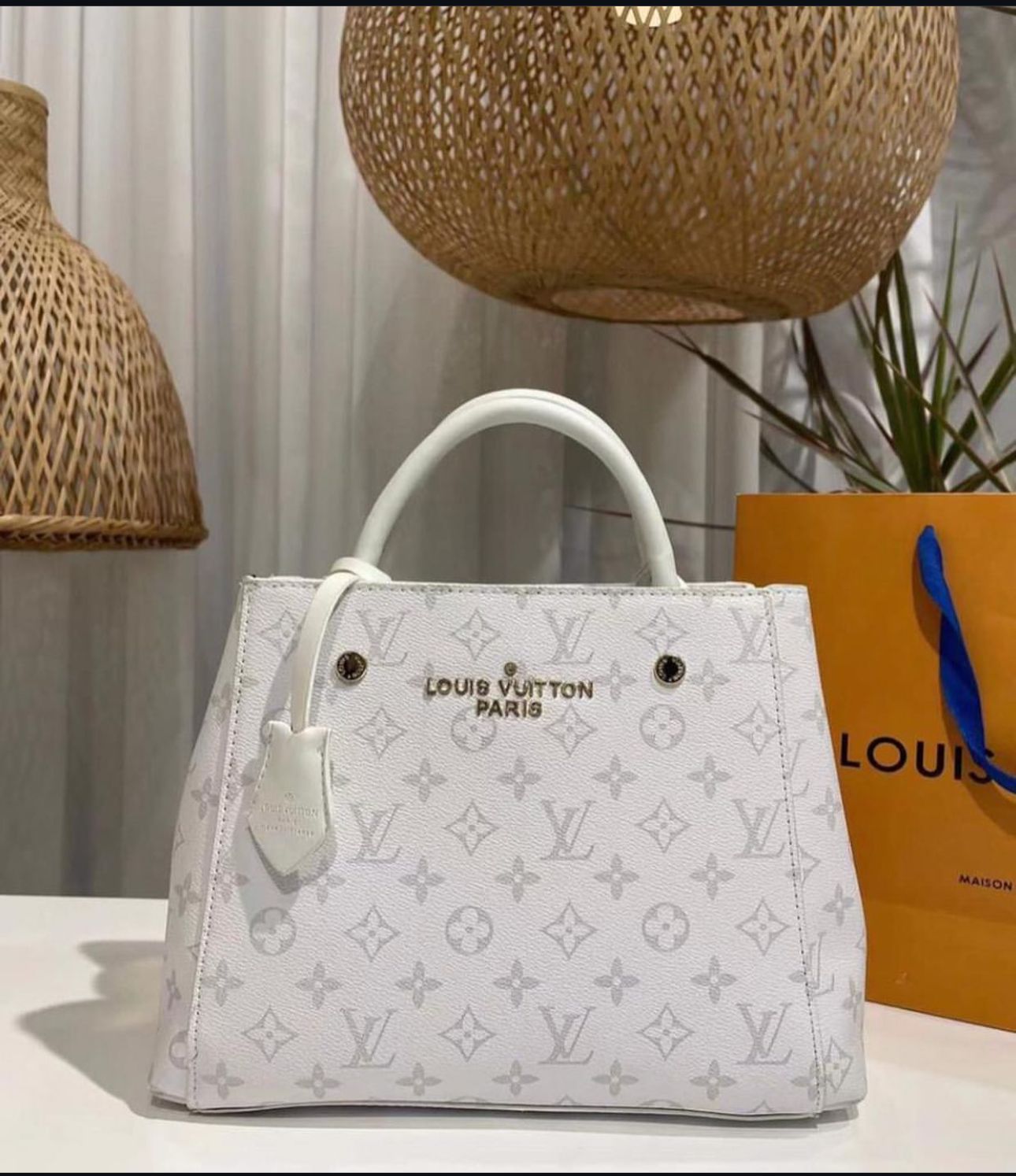 "Louis Vuitton Monogram Empreinte White Leather Tote – Timeless Elegance & Luxury"